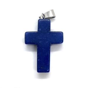 Close-up of a blue lapis lazuli cross pendant with a silver metal clasp and natural stone texture
