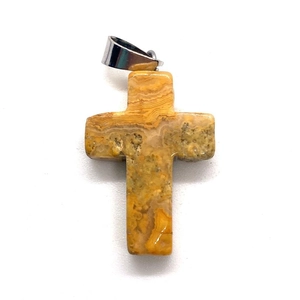 Macro shot of cross pendant with natural striped agate texture and silver metal clasp