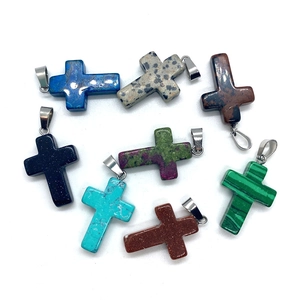 Cross pendants made of natural stones like malachite and tiger eye with steel loops