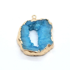 Irregular blue geode agate pendant with gold plated edges and natural crystal cluster