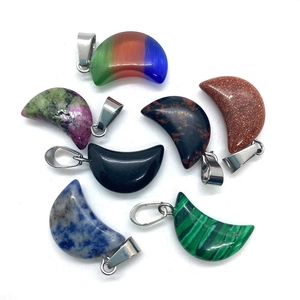 Set of seven moon-shaped natural stone pendants with silver clasps in diverse colors
