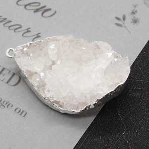 Natural white druzy stone pendant with silver metallic edging and teardrop shape