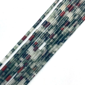 Macro shot of 2x4mm bloodstone cylinders showing deep red and dark green patterns