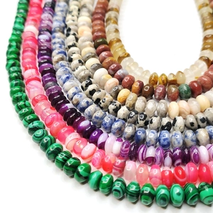 Macro detail of various colorful 4x6mm rondelle natural stone beads for DIY jewelry making