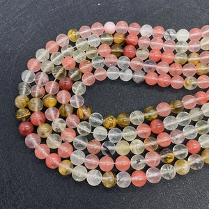 Macro detail of natural round gemstone beads with internal mineral inclusions for jewelry DIY