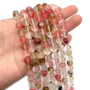 Mixed color natural stone beads for DIY jewelry making shown held in hand