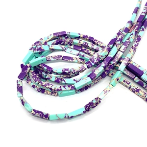 Close-up of rectangular purple and teal Imperial Jasper beads for jewelry making