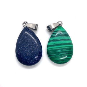 Set of two teardrop natural stone pendants featuring Blue Sandstone and Malachite textures