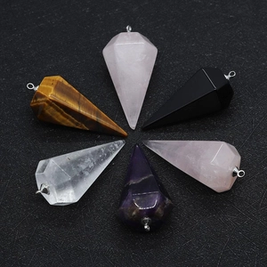 Detailed view of six assorted hexagonal crystal prism pendants including rose quartz and amethyst