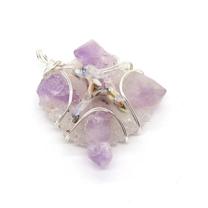 Natural purple amethyst cross pendant with handmade silver wire wrapping on white background