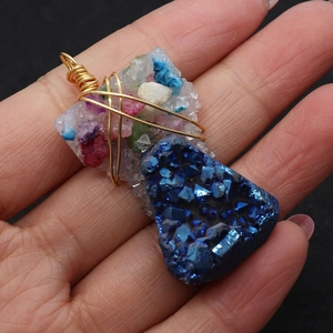 Natural blue crystal pendant with colorful crushed stones and golden wire wrapping design
