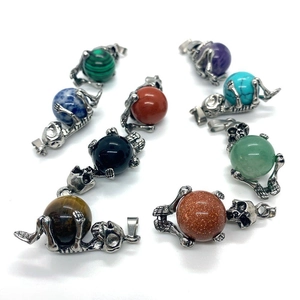Gothic skull pendant with natural stones like malachite and amethyst for DIY jewelry