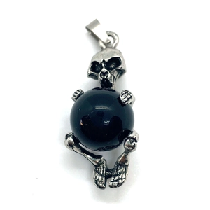 Gothic punk style skull pendant with large black stone bead and silver metal frame