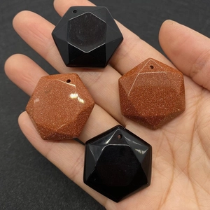 Macro view of geometric hexagonal faceted natural stone pendants for DIY jewelry
