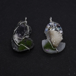 Handmade wire wrapped natural stone pendants featuring purple and white crystal clusters