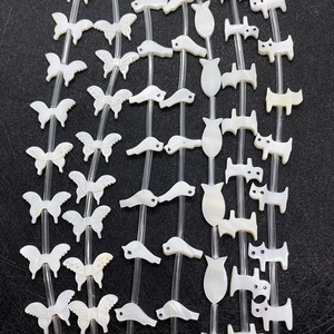 Animal-shaped white shell beads including butterflies and fish for DIY jewelry