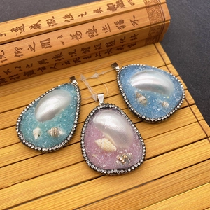 Waterdrop-shaped natural shell resin pendants with rhinestones in pink and blue colors