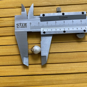 Detailed measurement of a 10mm irregular freshwater pearl pendant with gold cap