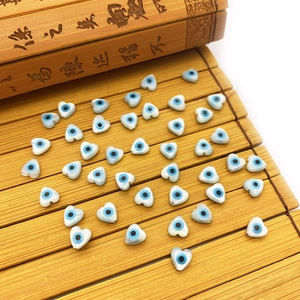 Natural heart shell beads with blue evil eye pattern for necklace jewelry making
