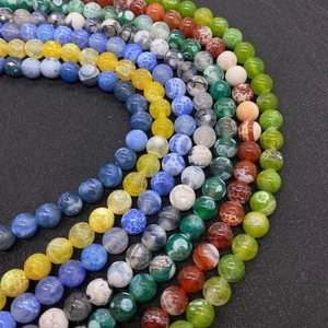 Macro shot of colorful dragon vein agate round beads with cracked texture for DIY jewelry