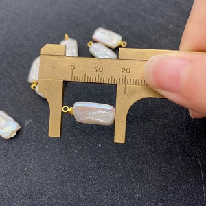 Baroque irregular rectangular freshwater pearl pendant measured at 20mm with gold bail