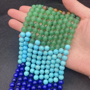 Detail of natural mixed tiger eye and turquoise stone beads for DIY jewelry making