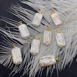Irregular rectangular baroque freshwater pearl pendants with iridescent white luster and gold loops