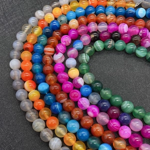 Macro shot of polished 6mm-10mm colorful striped agate beads for DIY jewelry making