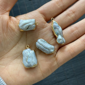 Natural baroque freshwater pearl pendants with gold plated edges and irregular shapes