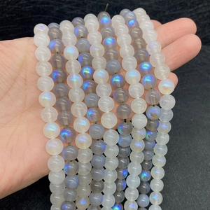 Detail of natural moonstone beads with blue luster for DIY jewelry making