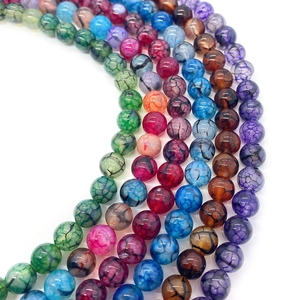 Macro shot of colorful dragon vein agate round beads for DIY jewelry making accessories