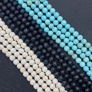 Natural round turquoise beads set in blue, black, and white stone styles for DIY jewelry