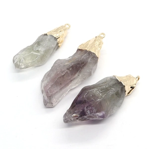 Natural irregular stone pendants in purple and green with gold plated metal caps