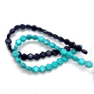 Macro shot of faceted turquoise and blue sandstone beads for DIY jewelry making