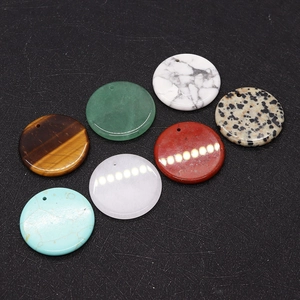 Macro view of assorted 30mm natural stone round flat pendants for DIY jewelry making