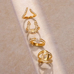 Macro shot of gold micro-pave zircon rings with V-shape and U-shape designs