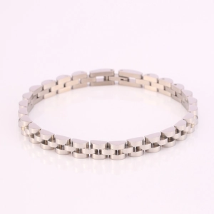 Detail view of silver stainless steel three-bead link watch band bracelet with fold-over clasp