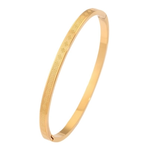 Gold-tone titanium steel cuff bracelet with vintage Greek key patterns on white background