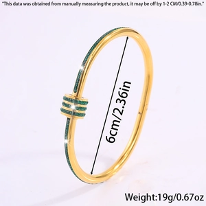 Detailed view of titanium steel gold bracelet with green zircons and dimension markings