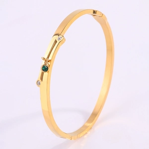 Elegant gold-plated stainless steel cross bracelet with emerald green zircon stone