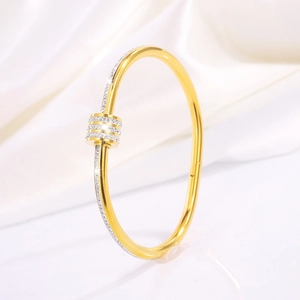 Detailed macro view of the gold-plated bangle with sparkling white zircon ring centerpiece