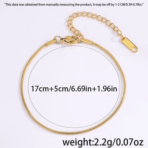 Detail view of gold stainless steel snake chain with lobster clasp and extension link