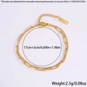 Detail of 18K gold double layer bracelet with paperclip chain and lobster clasp