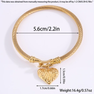 Elegant gold twisted bangle with lava texture heart pendant and dimensions description