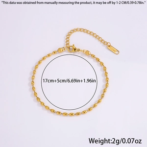 Detail view of 18k gold plated steel beaded bracelet with lobster clasp and tag