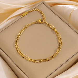 Double-layered gold stainless steel bracelet featuring paperclip chain and lobster clasp