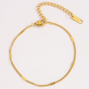 Gold stainless steel Figaro chain bracelet with adjustable clover pull design for women