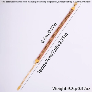 Detailed view of 18k gold plated stainless steel curb bracelet with pink zircon inlays