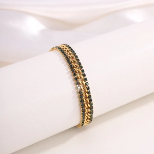 Luxurious 18k gold plated Cuban chain bracelet with emerald green crystals on silk
