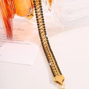 Close-up of 18k gold plated titanium steel chain featuring rows of black cubic zirconia stones
